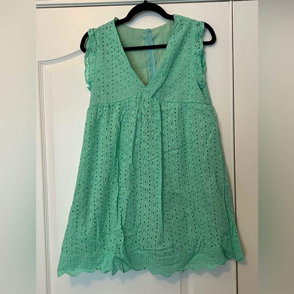 Aqua colored eyelet dress with shorts and pockets
